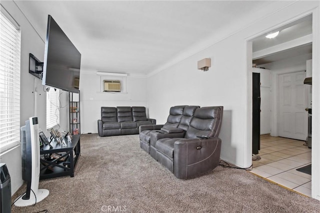 carpeted living area with tile patterned floors and a wall mounted AC