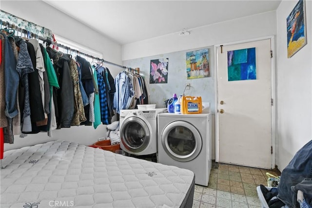 laundry area featuring tile patterned floors, washing machine and dryer, and laundry area