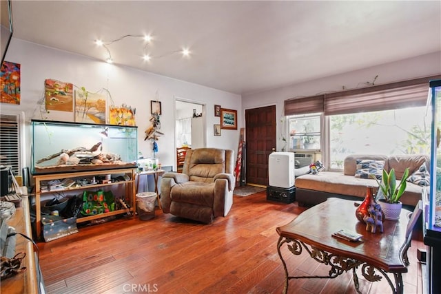 living area with wood-type flooring