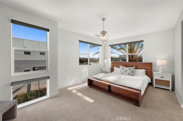 carpeted bedroom with baseboards