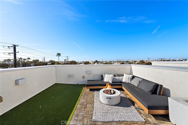 view of patio featuring an outdoor living space with a fire pit