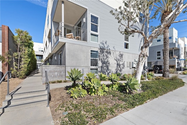 view of side of property with stucco siding