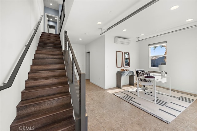 stairway with tile patterned floors, recessed lighting, a wall mounted air conditioner, and baseboards