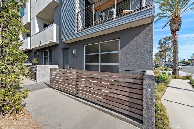 view of home's exterior featuring stucco siding and a balcony