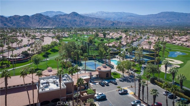 bird's eye view with a residential view, a mountain view, and view of golf course
