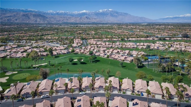 birds eye view of property featuring a mountain view, golf course view, and a residential view