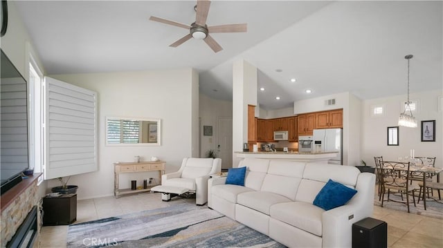 living room featuring recessed lighting, light tile patterned floors, a ceiling fan, and visible vents