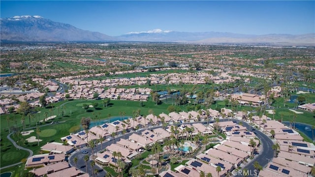 birds eye view of property with a mountain view, golf course view, and a residential view