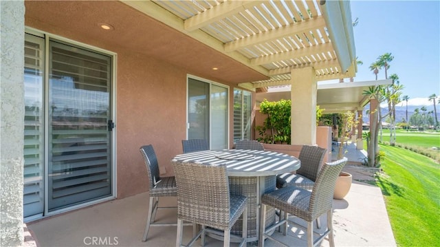 view of patio with outdoor dining space and a pergola