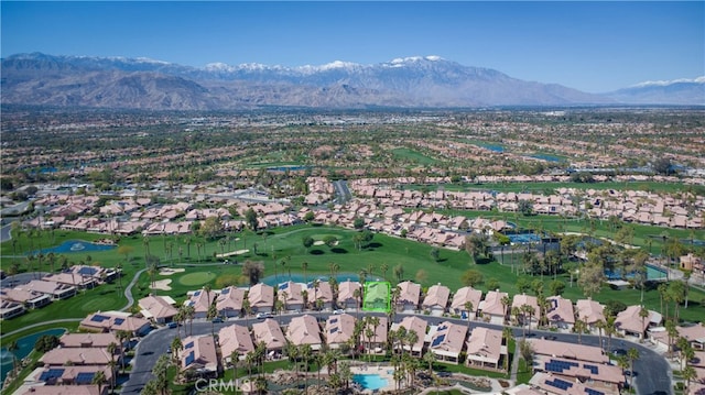 bird's eye view with a residential view, a mountain view, and golf course view