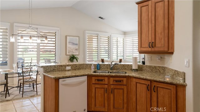 kitchen with a sink, brown cabinetry, and white dishwasher