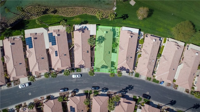 birds eye view of property with a residential view