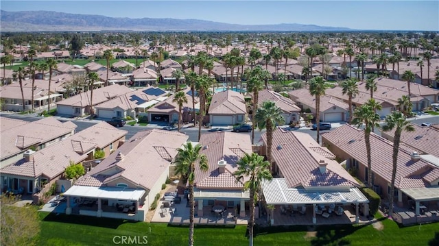 drone / aerial view with a mountain view and a residential view