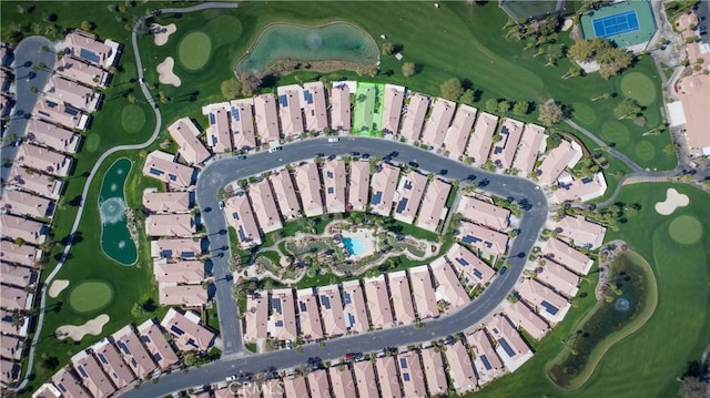 aerial view featuring view of golf course and a residential view