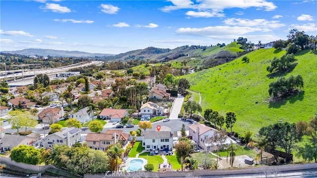 bird's eye view with a residential view and a mountain view