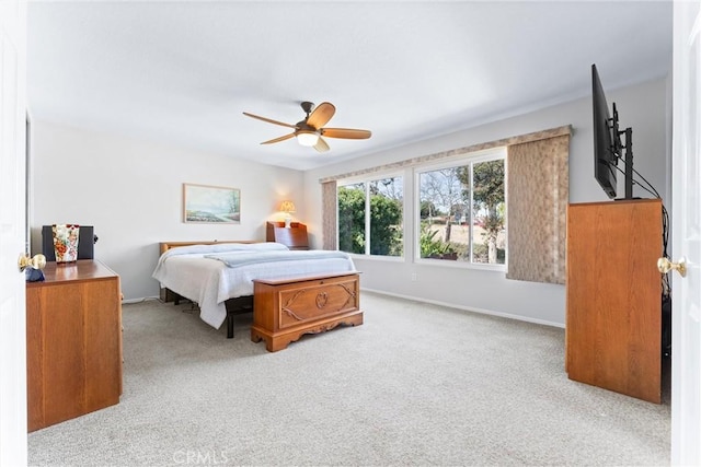 bedroom with baseboards, ceiling fan, and carpet flooring