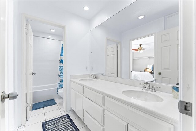 bathroom with a sink, double vanity, ensuite bathroom, and tile patterned flooring