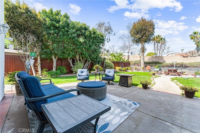 view of patio / terrace with an outdoor living space and a fenced backyard