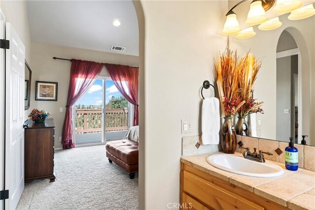 bathroom featuring visible vents and vanity