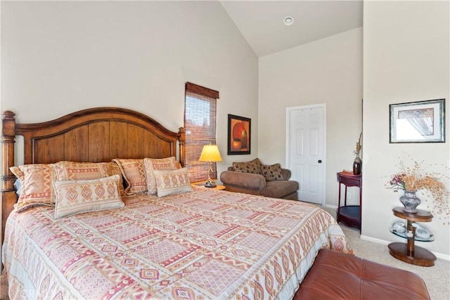 bedroom featuring carpet flooring, high vaulted ceiling, and baseboards