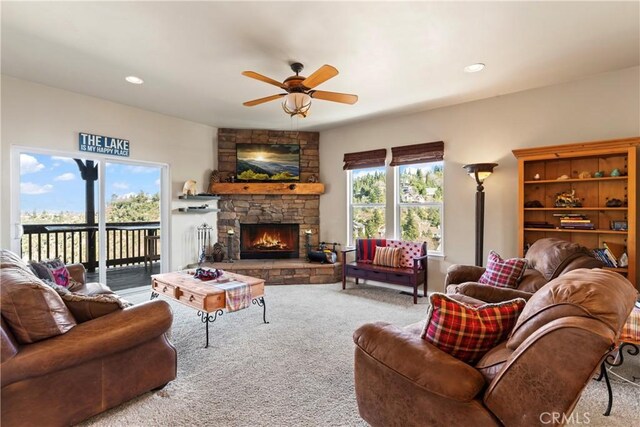 carpeted living room featuring plenty of natural light, a fireplace, recessed lighting, and ceiling fan