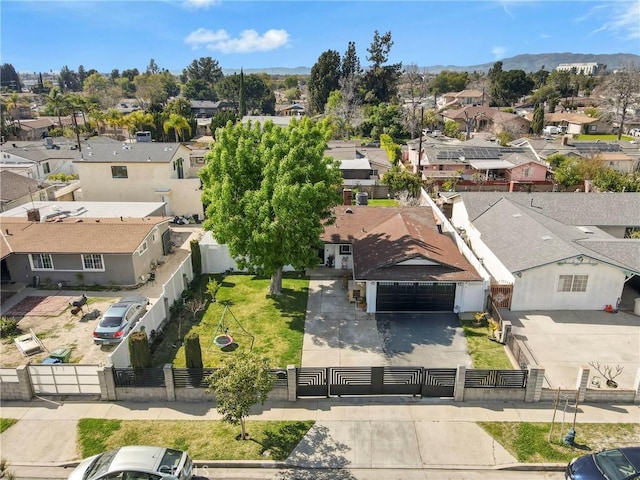 birds eye view of property featuring a mountain view and a residential view