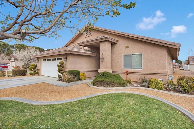 ranch-style home with stucco siding, an attached garage, and driveway