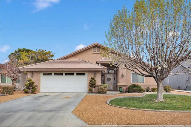 single story home featuring stucco siding, a front lawn, concrete driveway, a garage, and a tiled roof