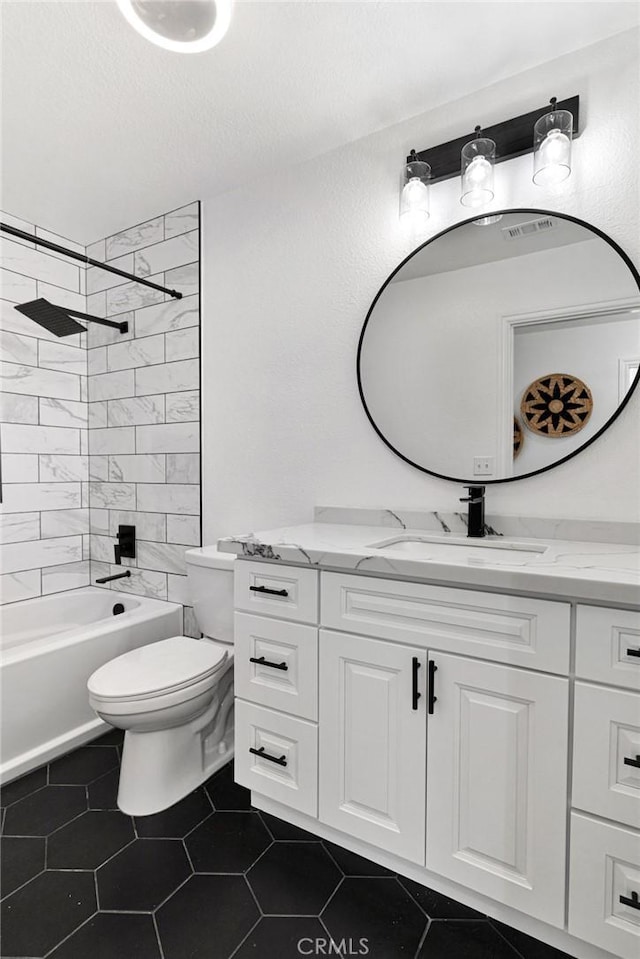 full bath with tile patterned flooring, visible vents, toilet, shower / tub combination, and vanity