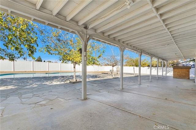 view of patio with a fenced in pool and a fenced backyard