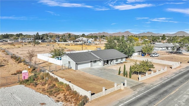 birds eye view of property with a mountain view