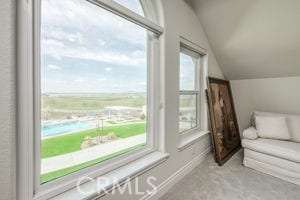bonus room featuring lofted ceiling and baseboards