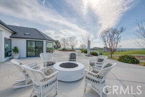 view of patio featuring an outdoor fire pit