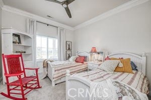 bedroom featuring ornamental molding and a ceiling fan