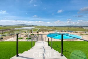 view of swimming pool with a yard
