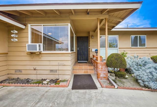 entrance to property with crawl space and cooling unit