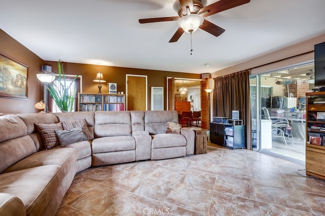 living area featuring a ceiling fan