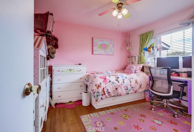 bedroom with ceiling fan and wood finished floors