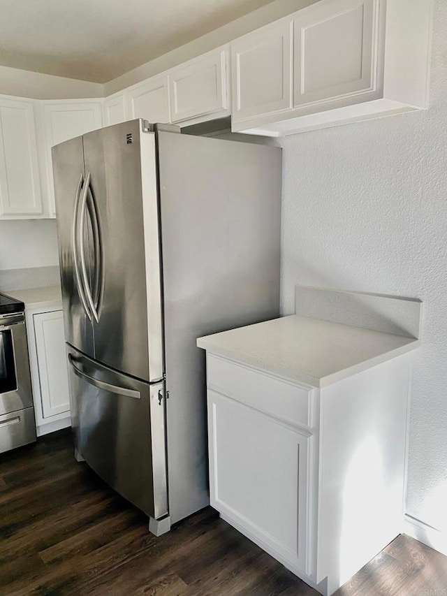 kitchen featuring white cabinets, dark wood-style floors, and stainless steel appliances