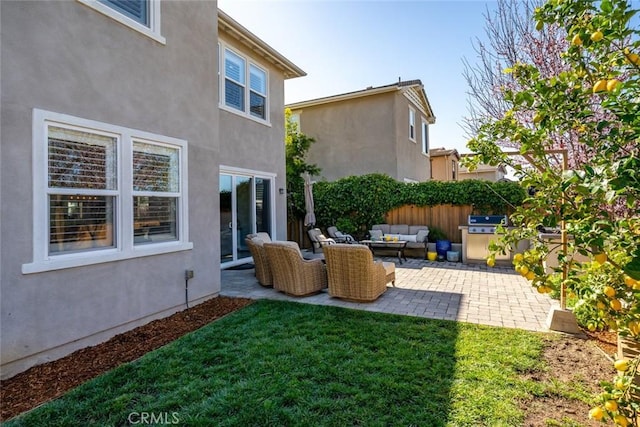 view of yard featuring outdoor lounge area, a patio, and fence