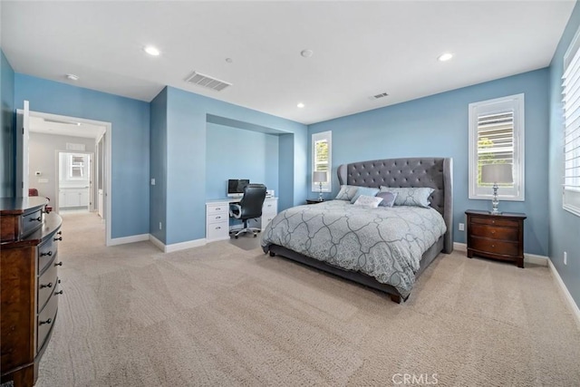 bedroom featuring recessed lighting, light colored carpet, visible vents, and baseboards