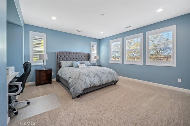 carpeted bedroom with visible vents, recessed lighting, and baseboards