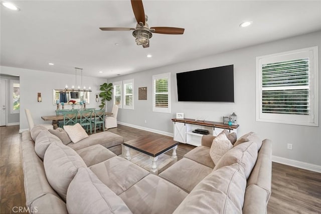 living area with recessed lighting, baseboards, wood finished floors, and ceiling fan