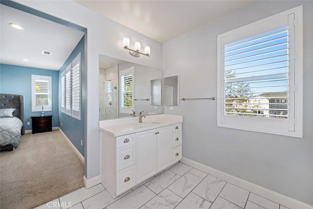 bathroom with vanity, baseboards, visible vents, tiled shower, and marble finish floor