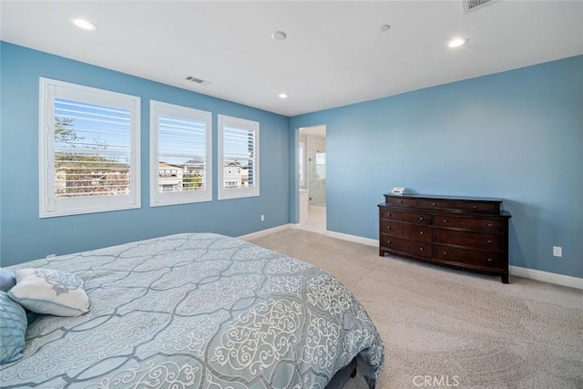 carpeted bedroom featuring recessed lighting, visible vents, and baseboards