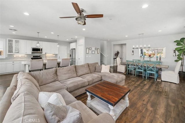 living area with recessed lighting, visible vents, dark wood finished floors, and a ceiling fan