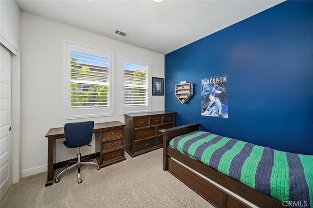 bedroom with baseboards, visible vents, and carpet floors