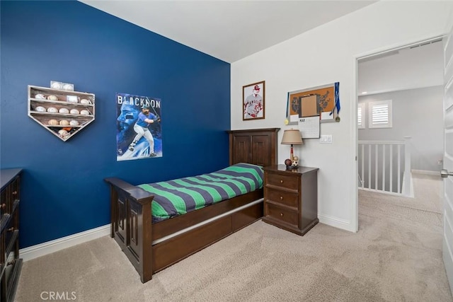 bedroom featuring baseboards and carpet floors