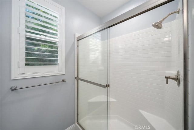 bathroom with a shower stall