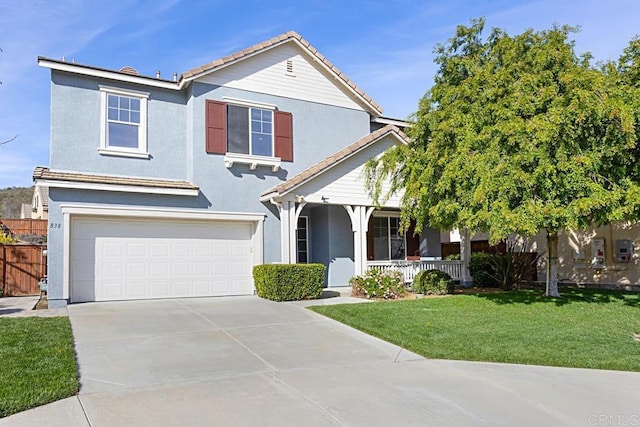 traditional home with stucco siding, driveway, a front lawn, a porch, and an attached garage